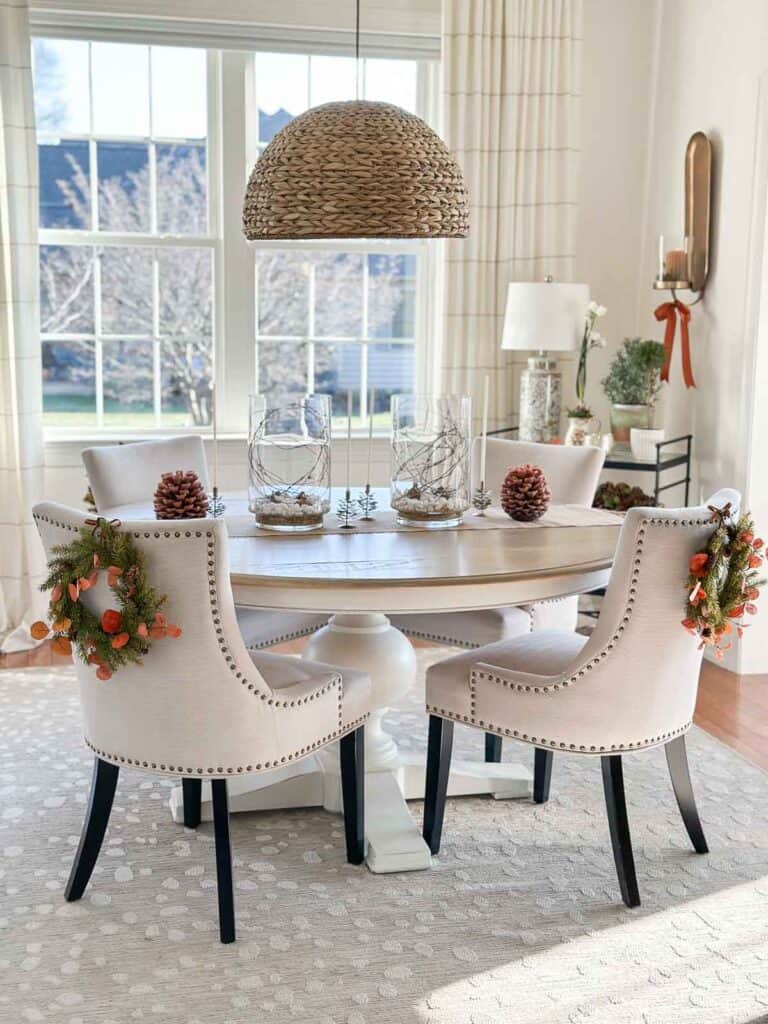 wreaths on the back of dining room chairs