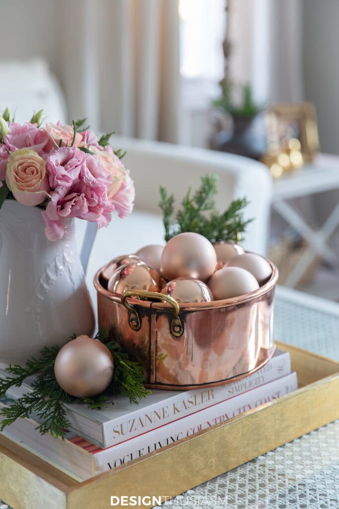 Copper pot filled with rose gold Christmas blls