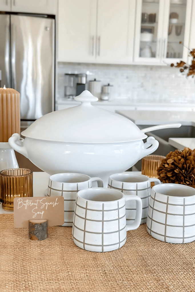 soup tureen and brown and white mugs