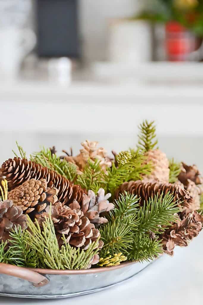 scented pinecones used in a small Christmas centerpiece with faux greens