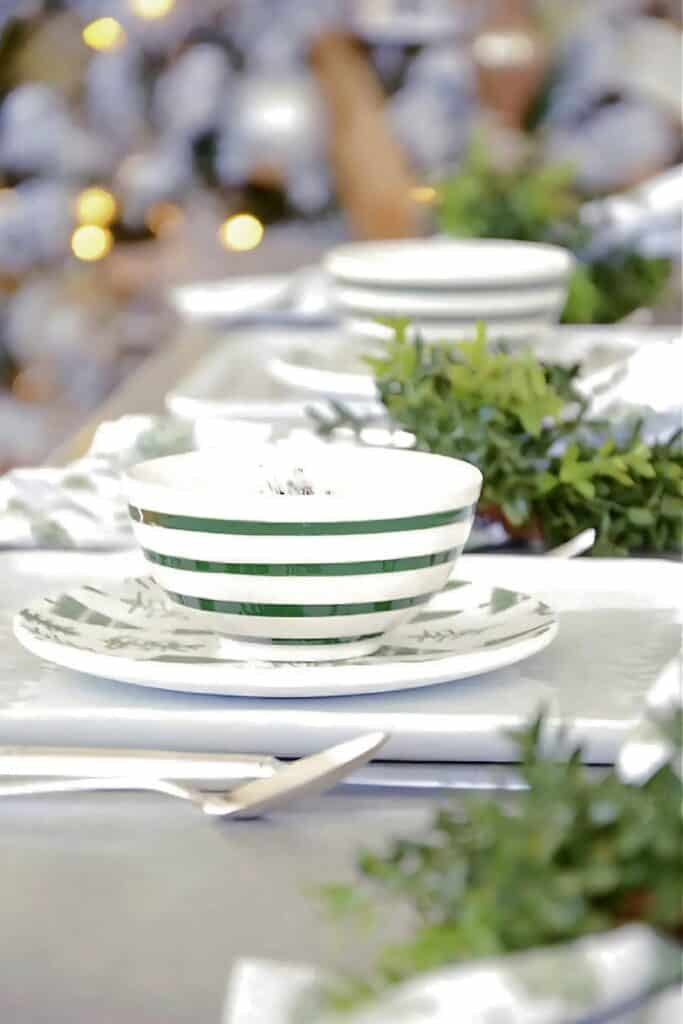 Christmas tablescape with green and white dishes-e