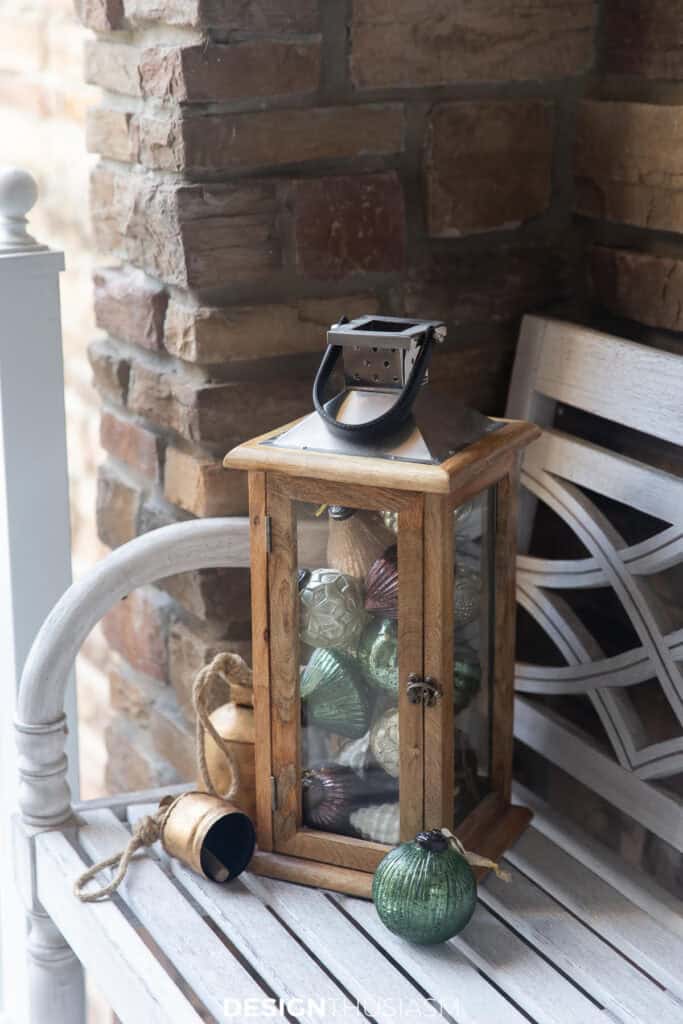 Wooden lanterns filled with Christmas ornaments