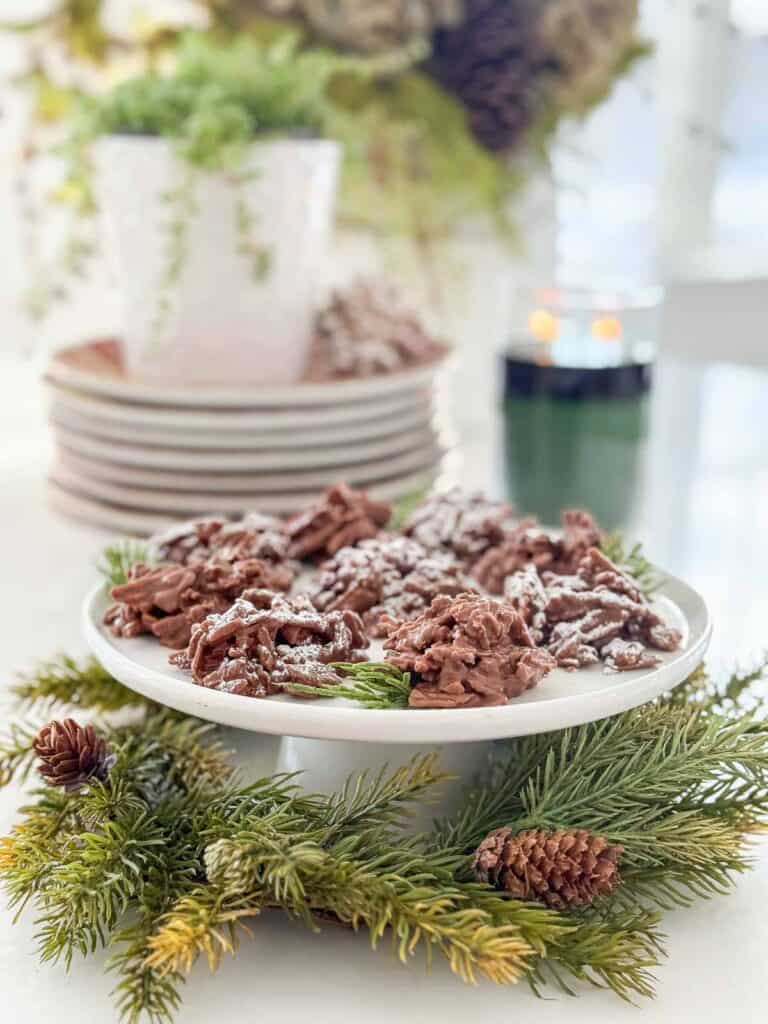 plate of haystack cookies surrounded by greens