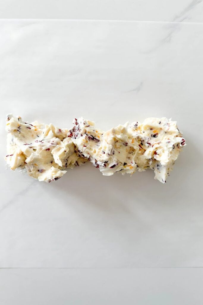 1 CRANBERRY ORANGE HONEY BUTTER- ingredients a log on parchment paper