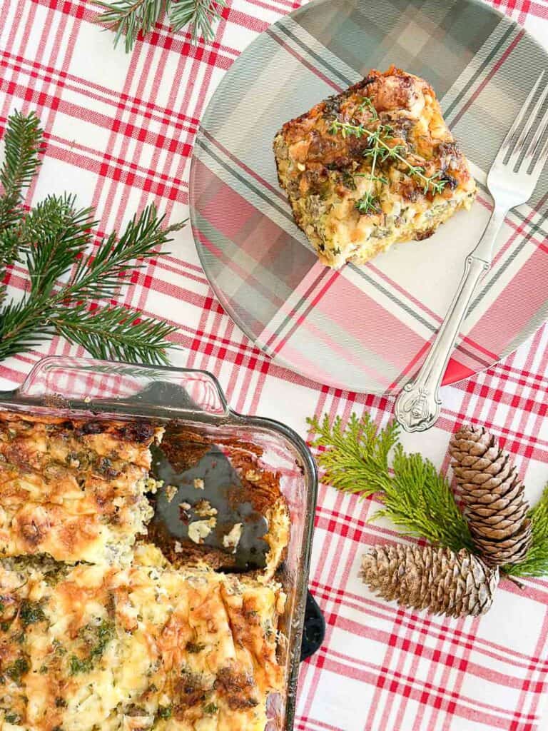 breakfast casserole in a glass dish and on a plaid plate.