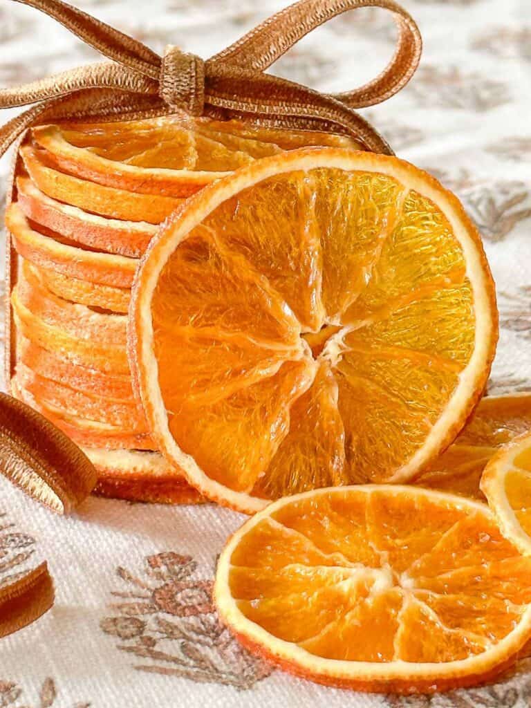 stack of dried oranges tied up with a velvet ribbon