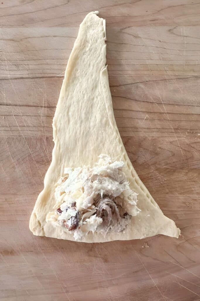 chicken filling on a dough triangle
