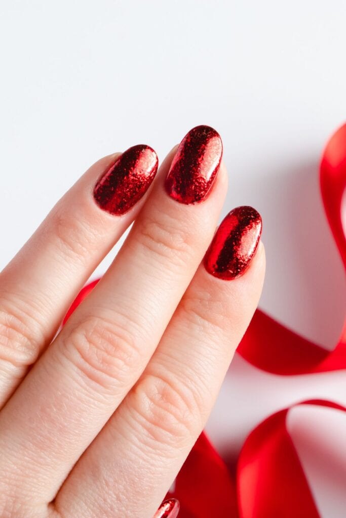 red nails and a red ribbon