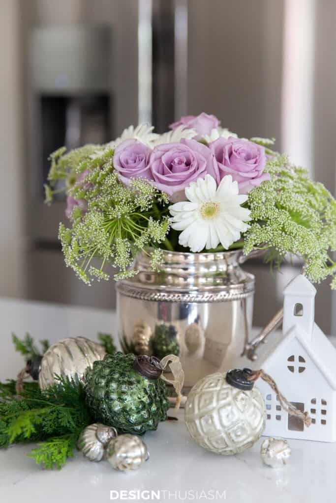 flowers and Christmas decor on a table