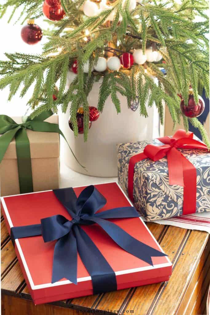 Christmas gifts under a tabletop tree