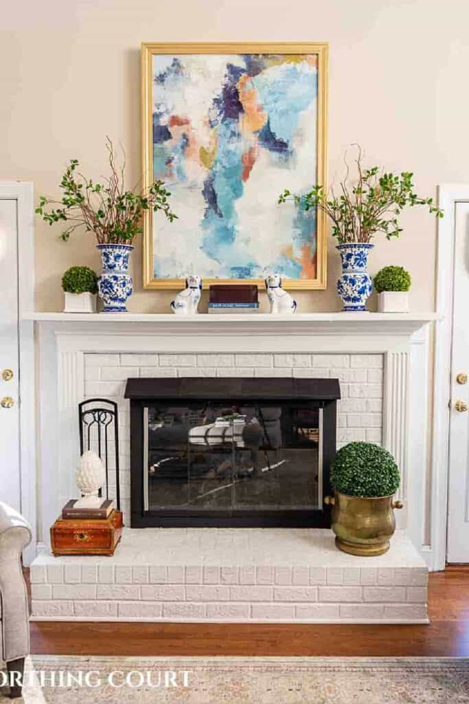 mantel with large abstract picture i a frame