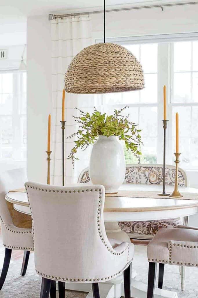 a french settee used as a bench in a dining room 