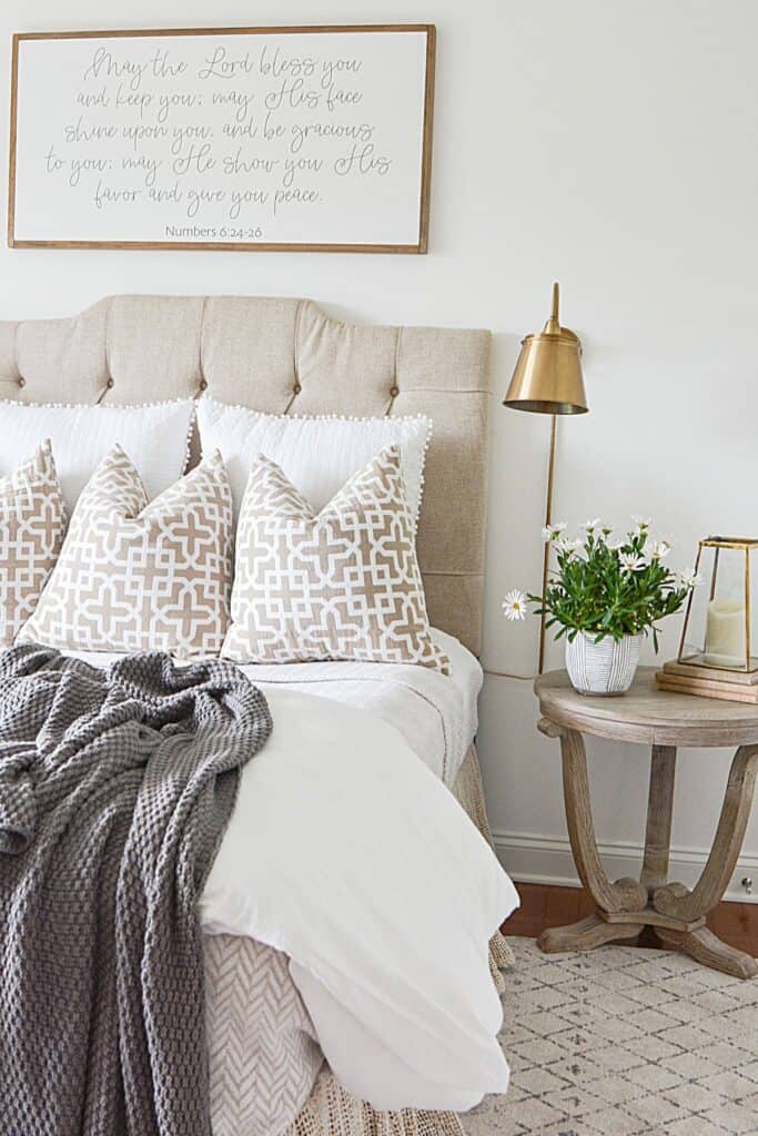 bed with a throw at the end of the bed