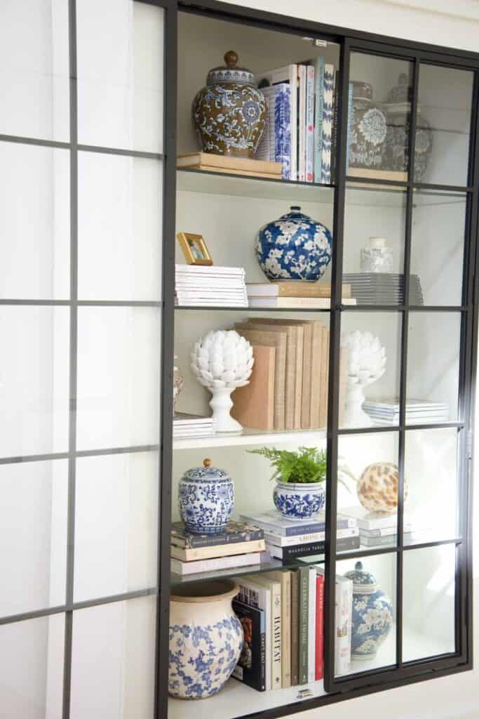 books and decor inside a bookcase