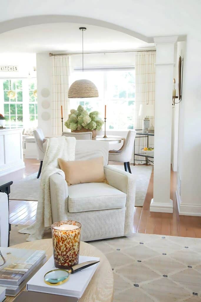 living room with an arch between the living room and dining room