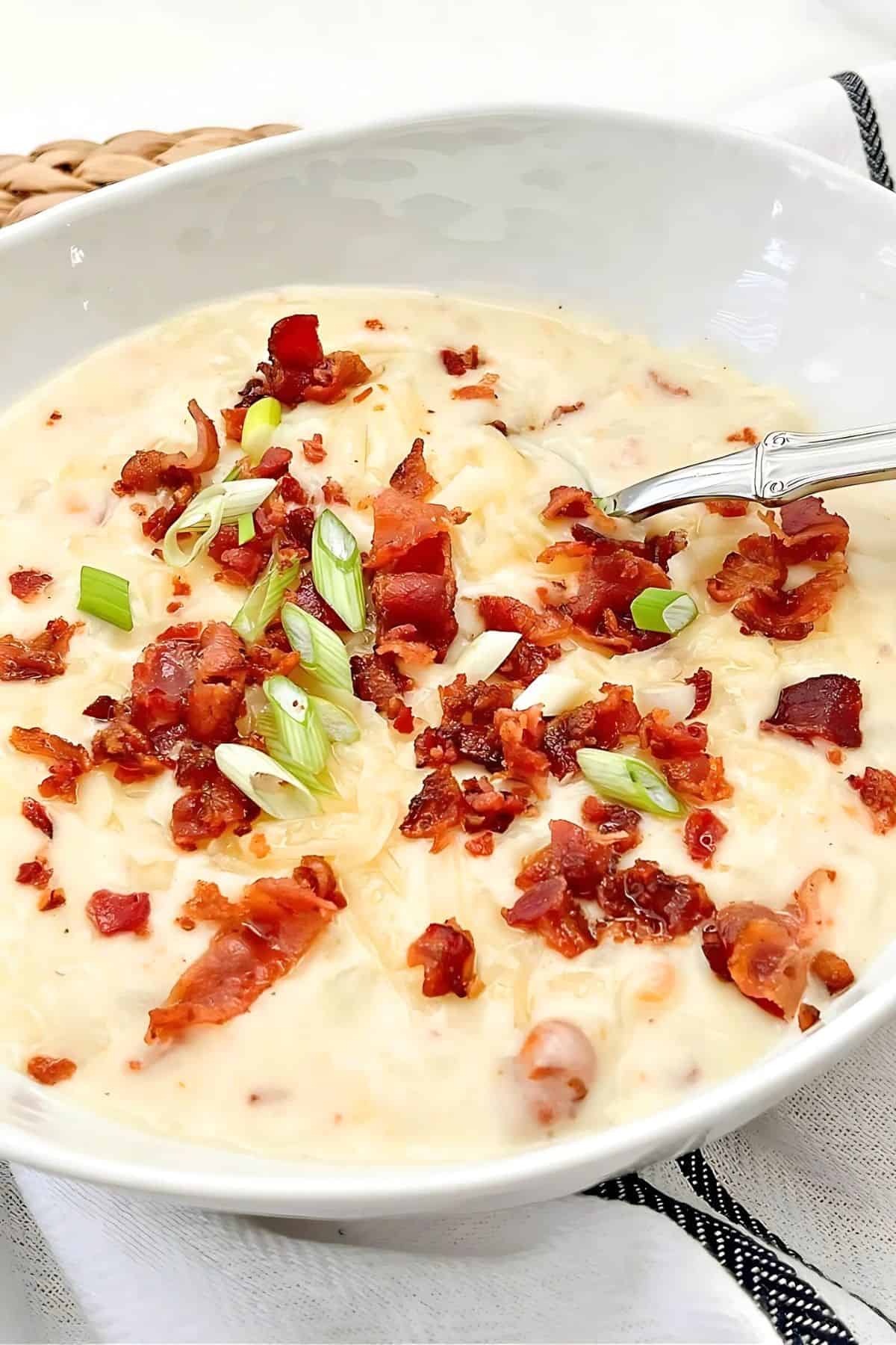 loaded potato soup garnished with bacon