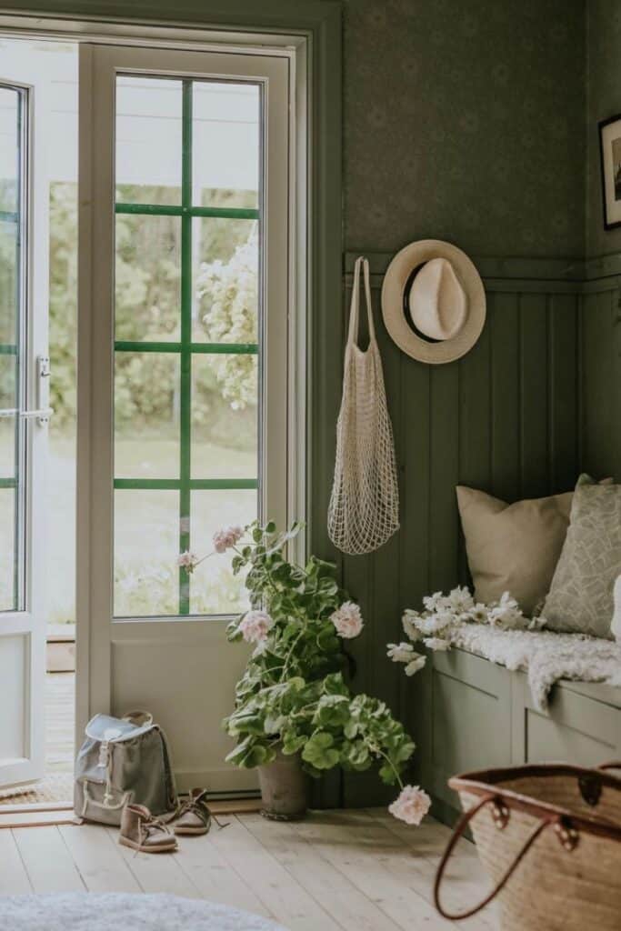 room with green wainscotting and wallpaper