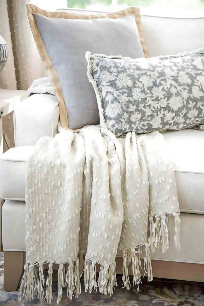 pillows and a throw on a sofa