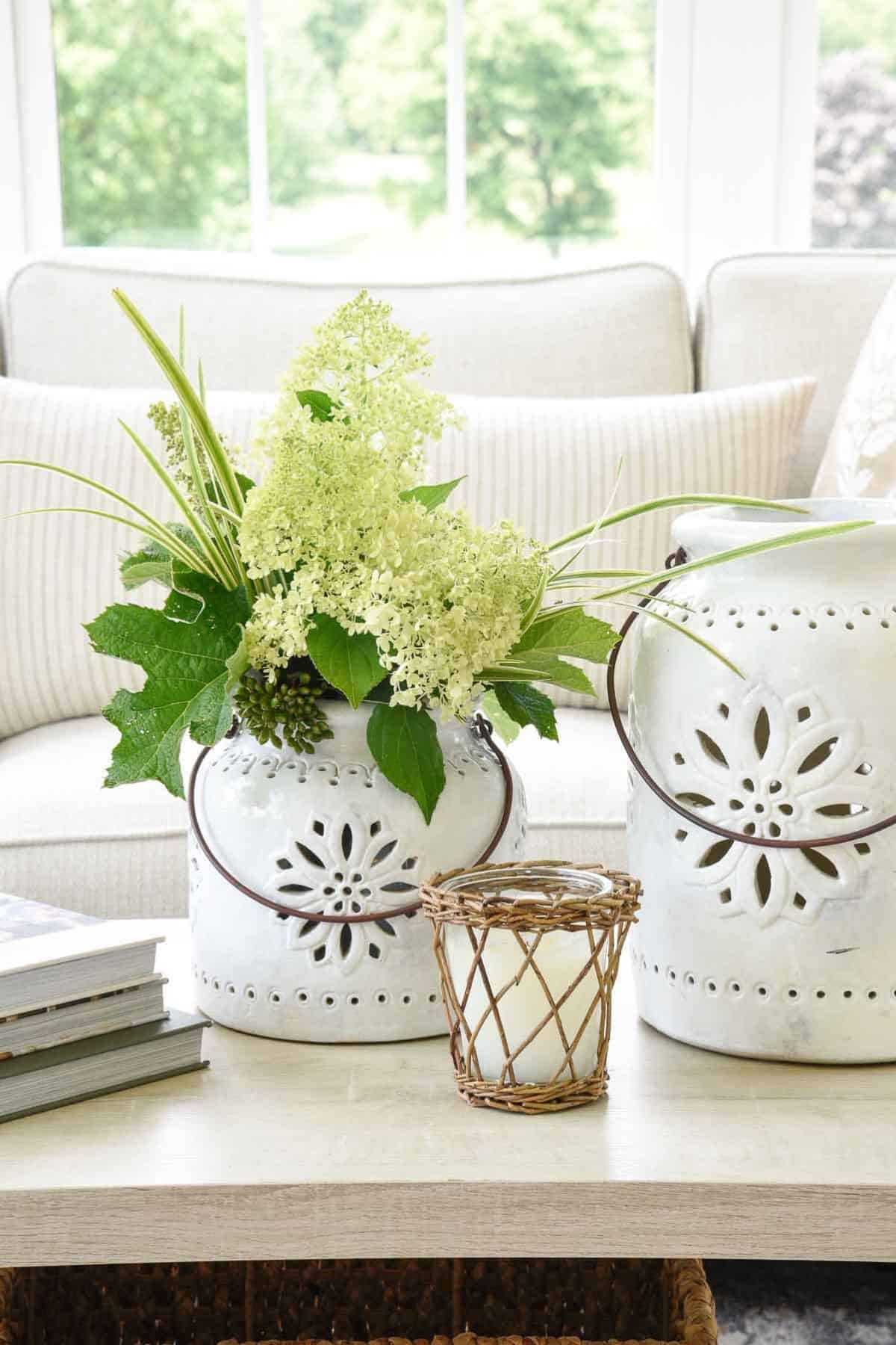 hydrangeas in a vase on a coffee table