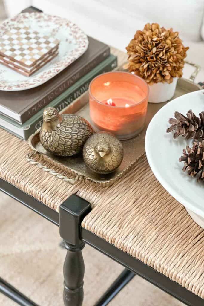 salt and pepper partridges in a brass tray on a coffee table