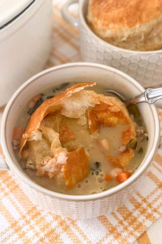 soup in bowl with puff pastry lids
