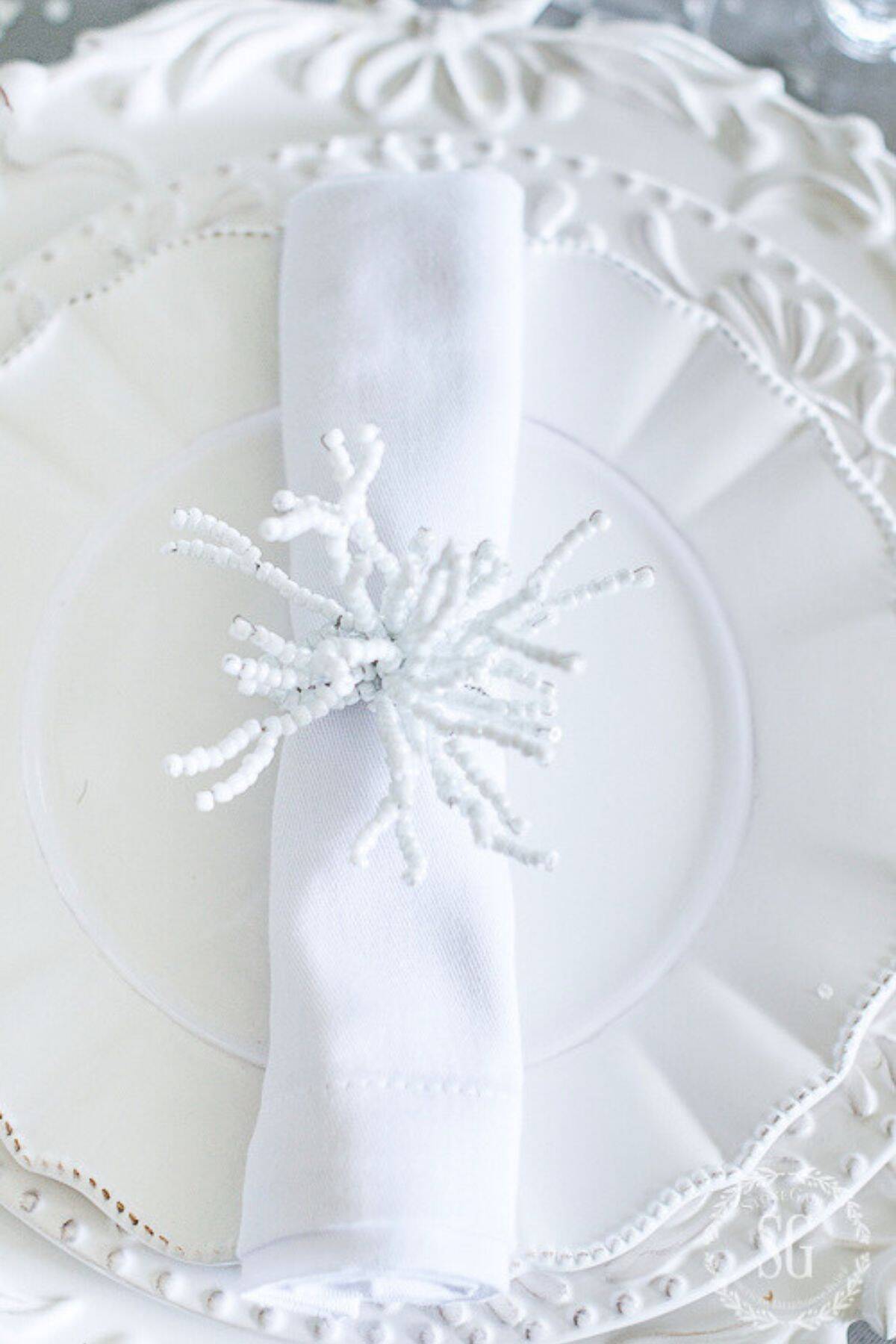 white place setting on a white tablecloth