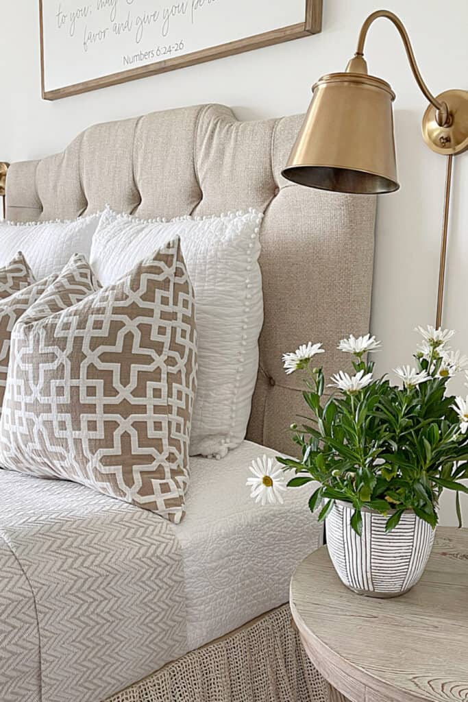 wall sconce next to a bed