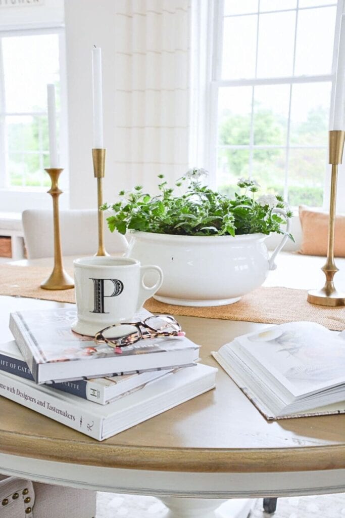 a planter of filled with green plants on a dining room table