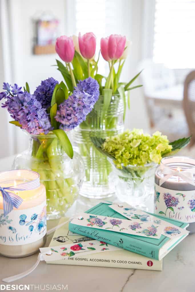 beautiful spring flowers in a vase with printables on books