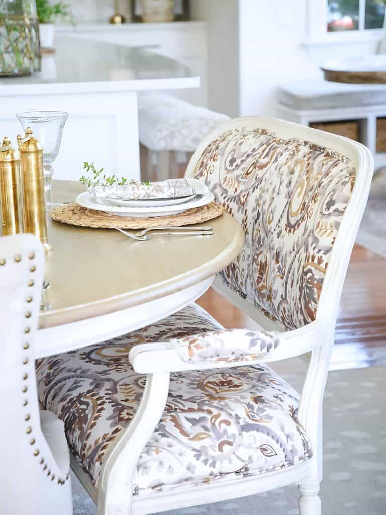 bench pulled up to dining room table.