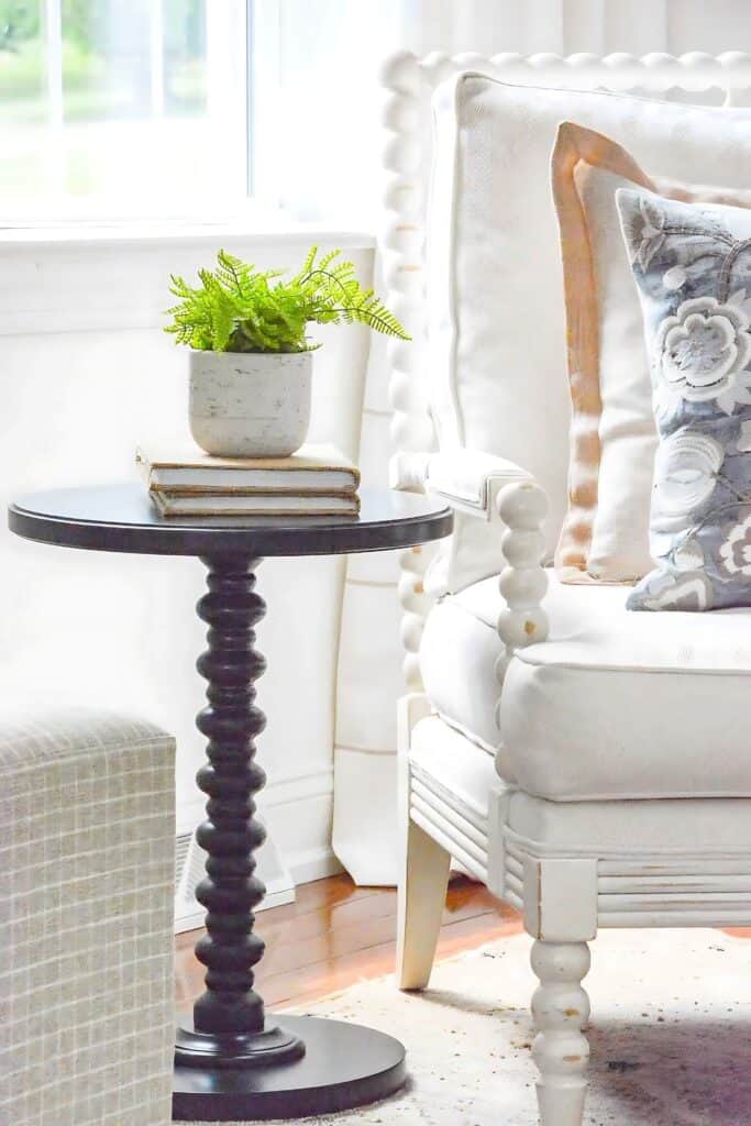 classic timeless white spindle chair with pillow