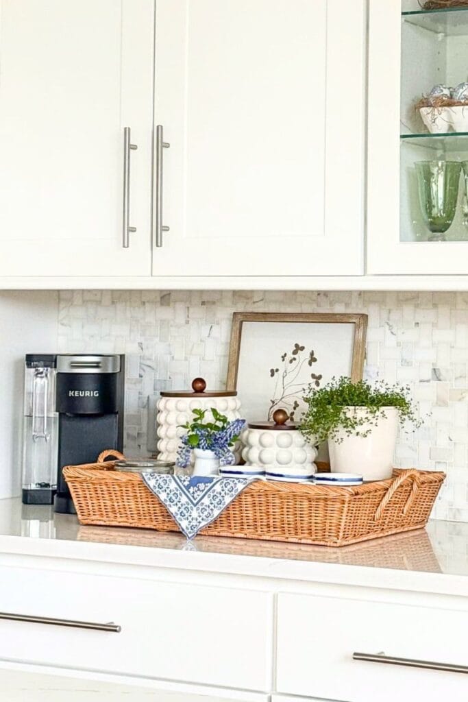 Kitchen coffee station decor with white hobnail canisters, spring lavender, and blue and white mugs