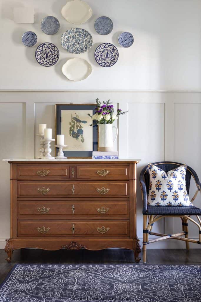 chest with a wall gallery above it