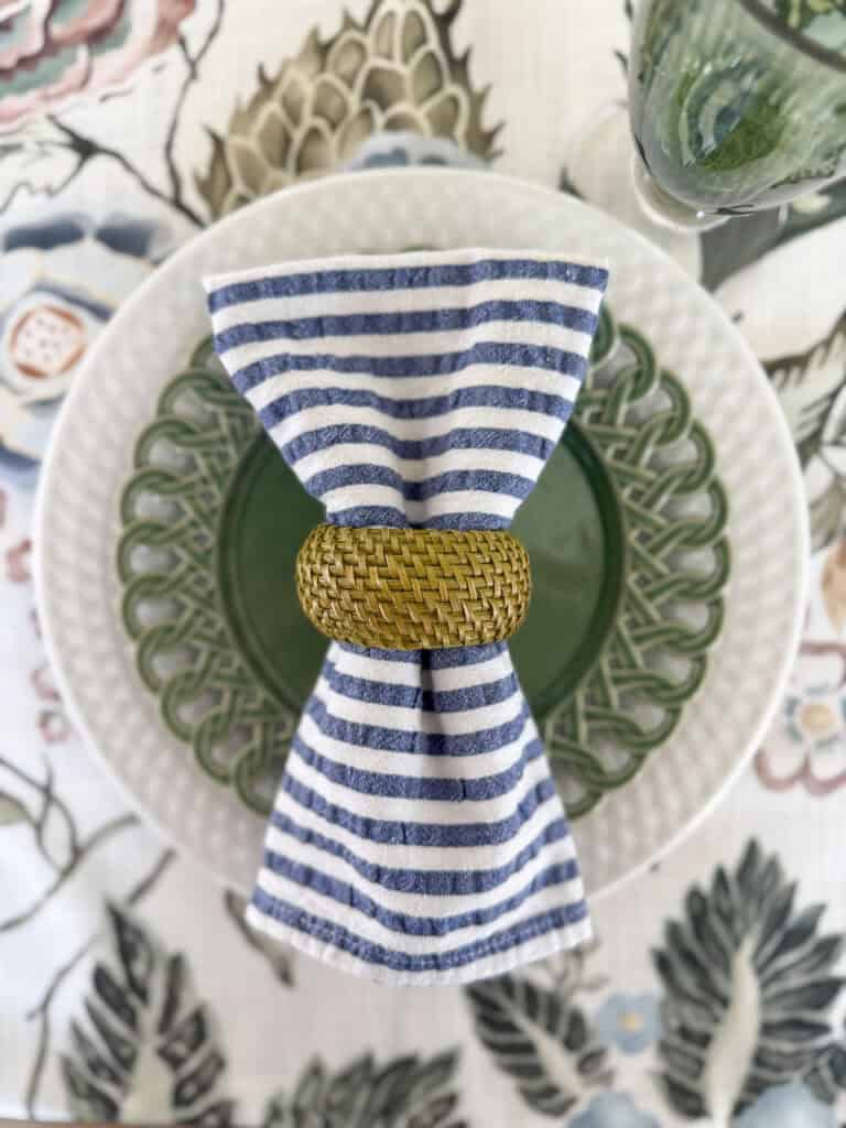 blue, white, and green place setting on a tablecloth with those colors