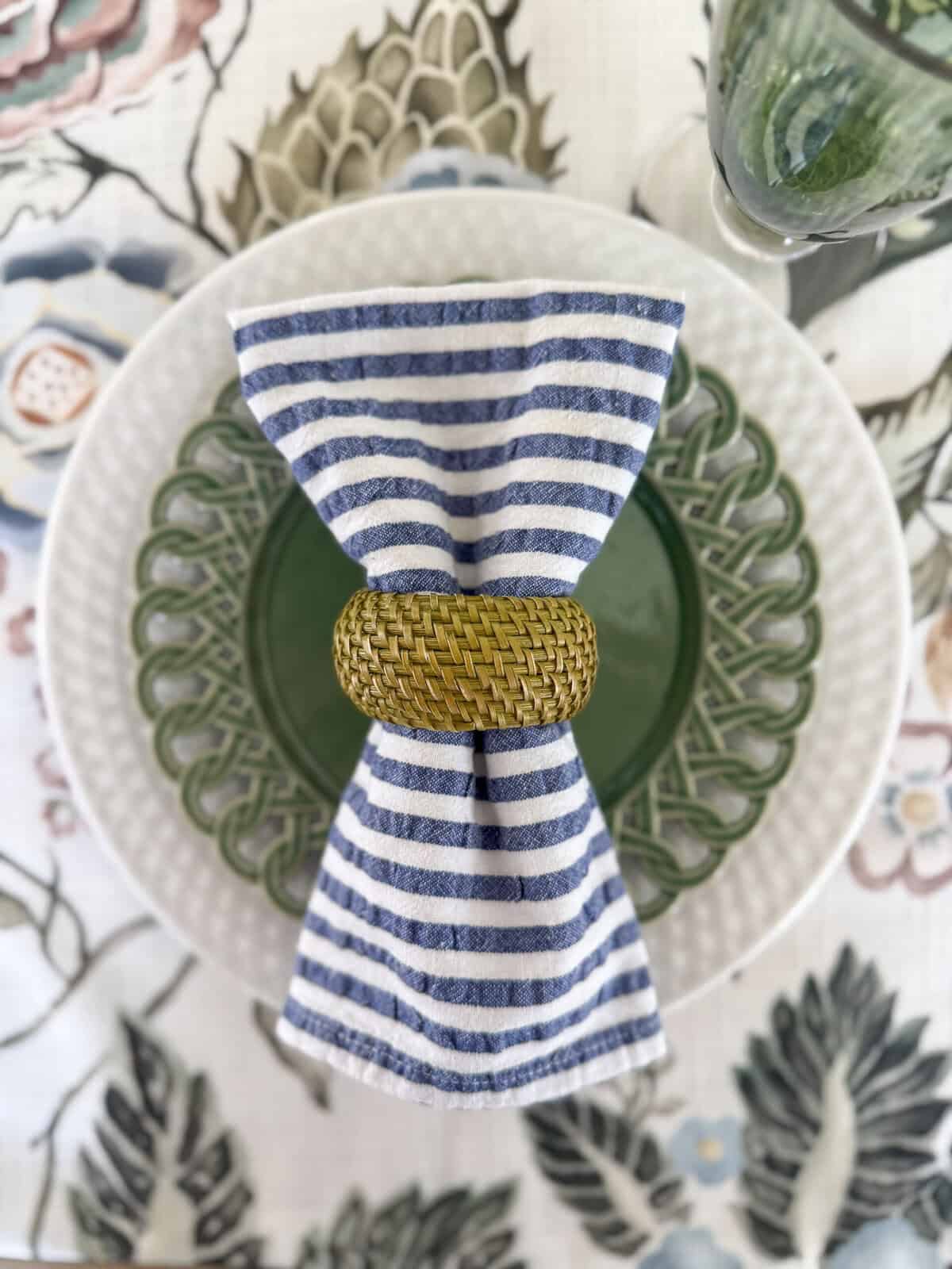 blue, white, and green place setting on a tablecloth with those colors