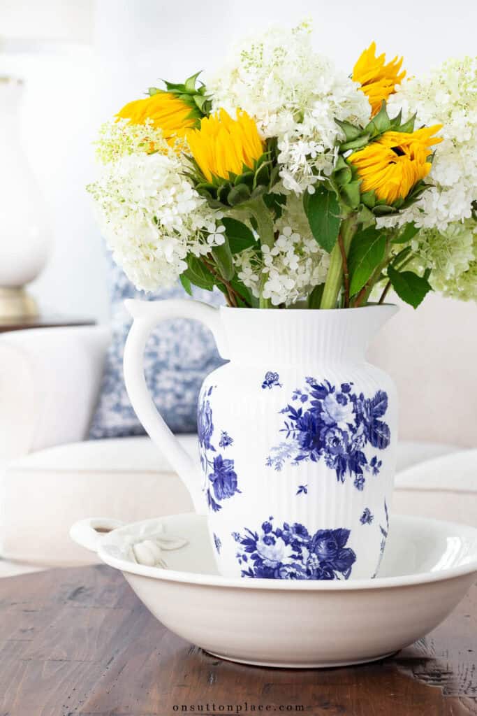 flowers in a blue and white pitcher