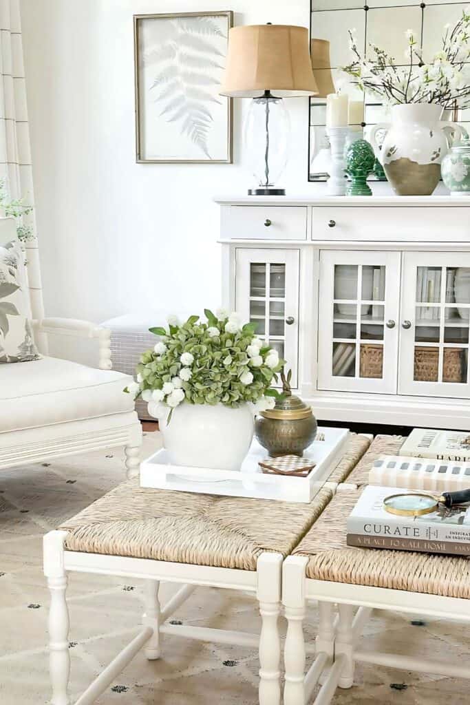 spring living room- rush seat benches used as a coffee table