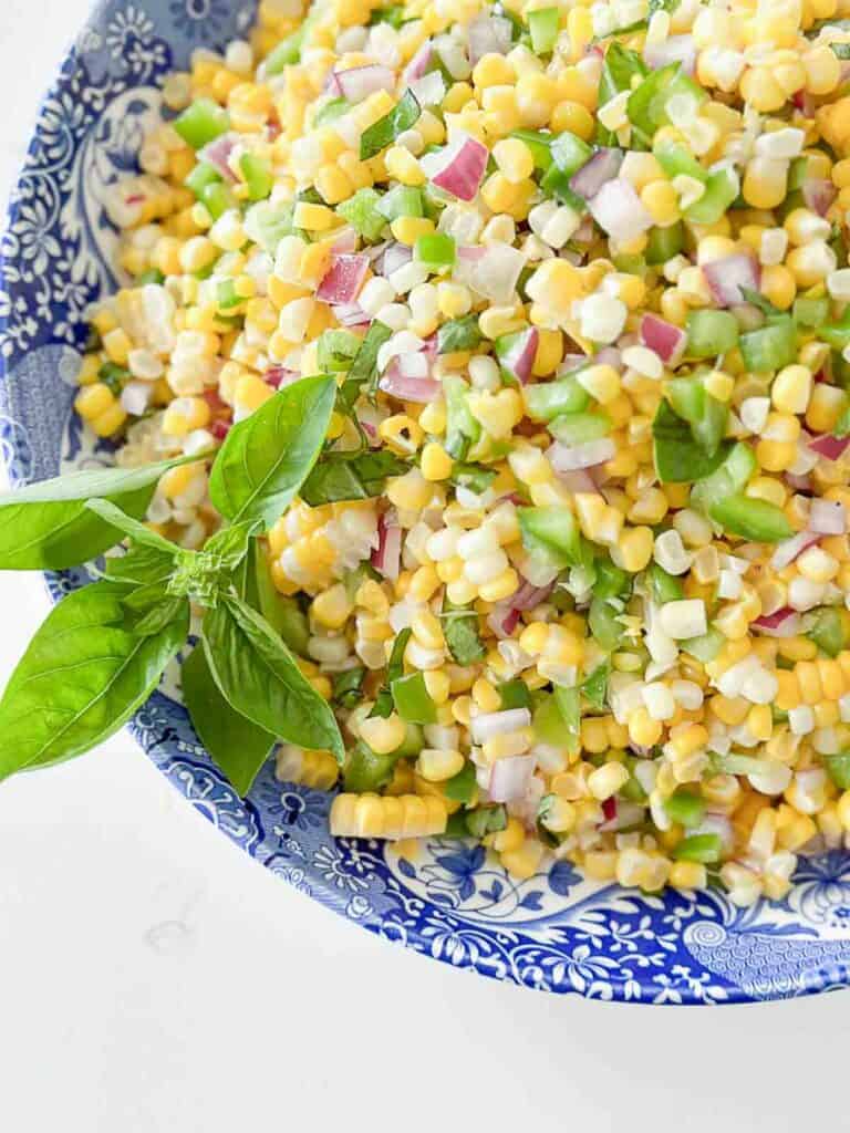 corn salad in a blue and white bowl