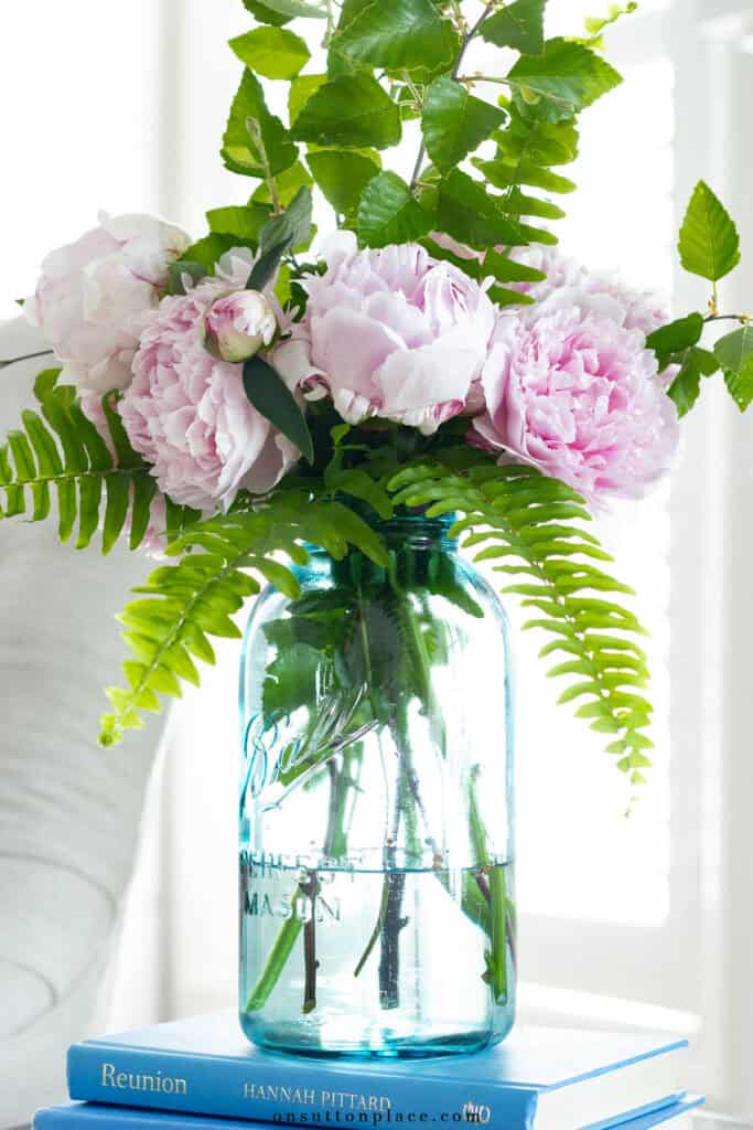 peony bouquet in a blue ball jar