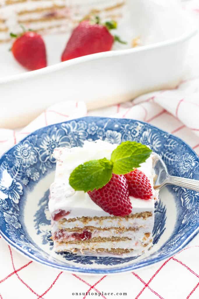 strawberry icebox cake on a blue and white plate