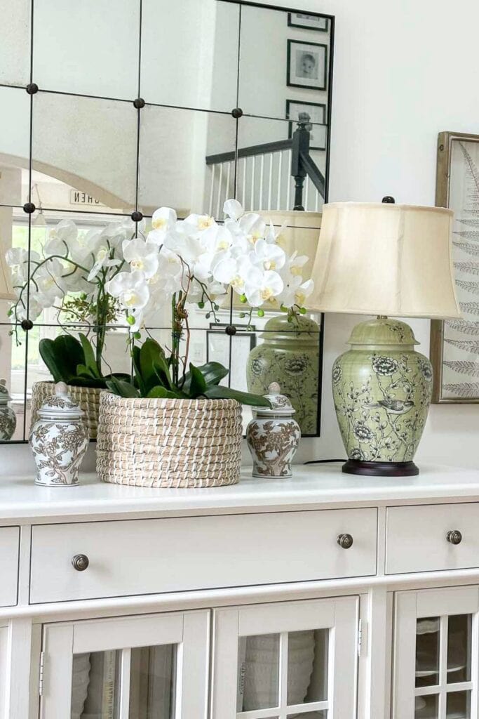 orchids blooming in a black pot