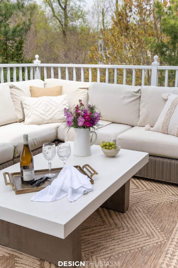 a sofa on a deck dressed up for summer