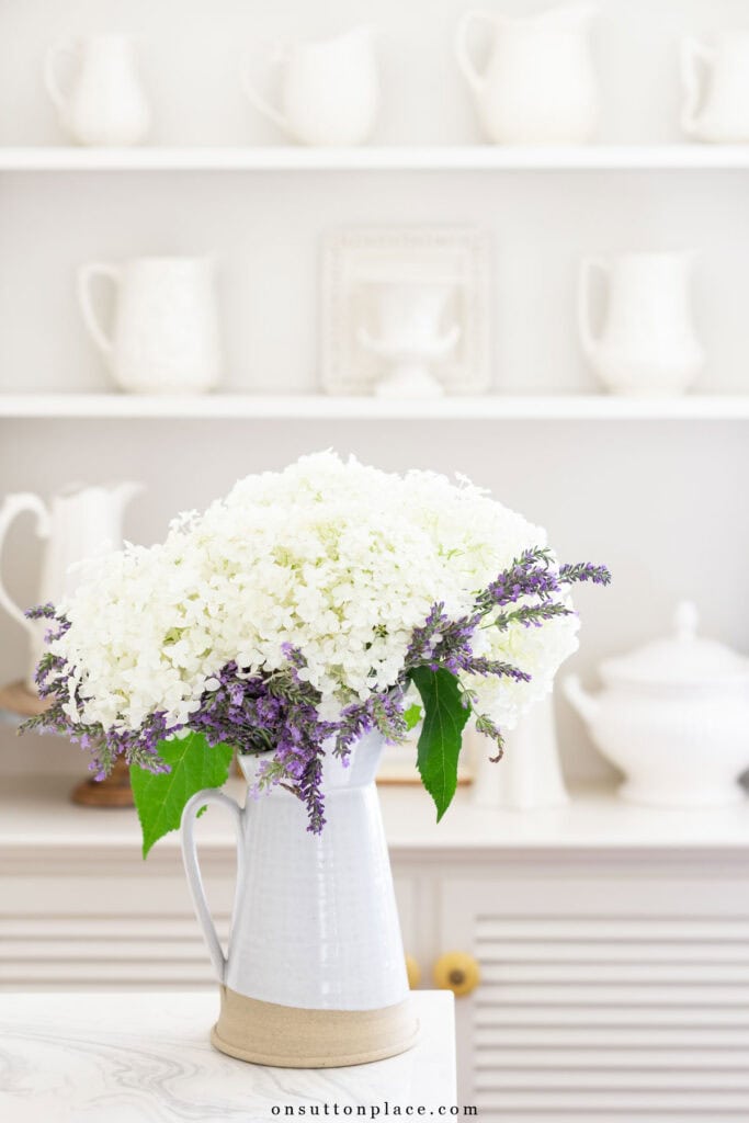 garden flowers in a white pitcher