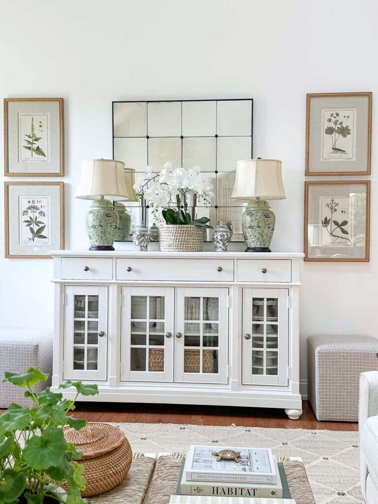 botanical prints flanking the white buffet