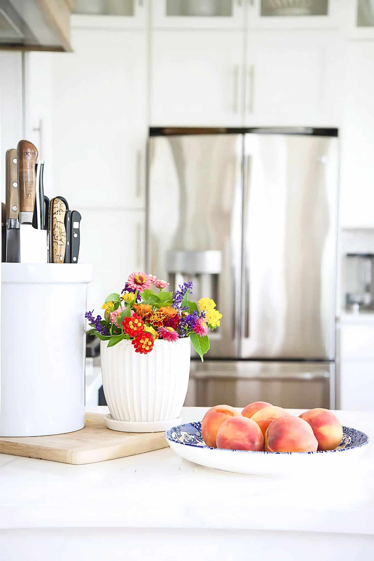 fruit and flowers in a kitchen