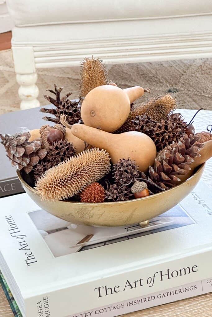 brass bowl with fall organics in it