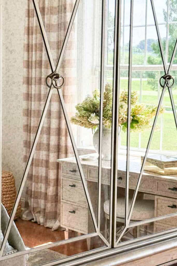 curtains in a bedroom looking across the bed