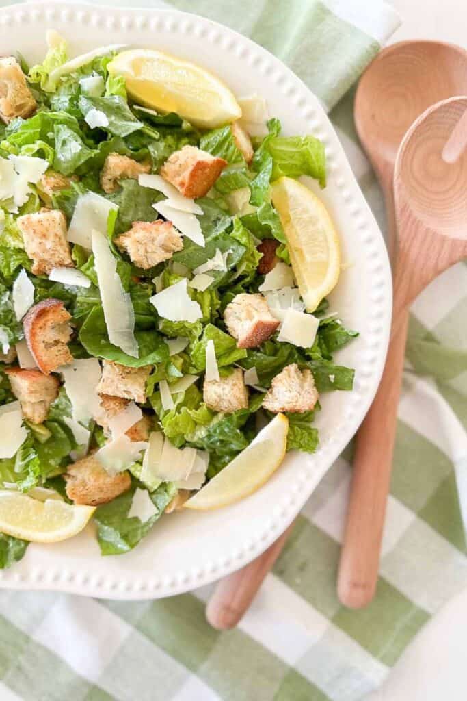 Caesar salad dressing in a white bowl with raised dot edge