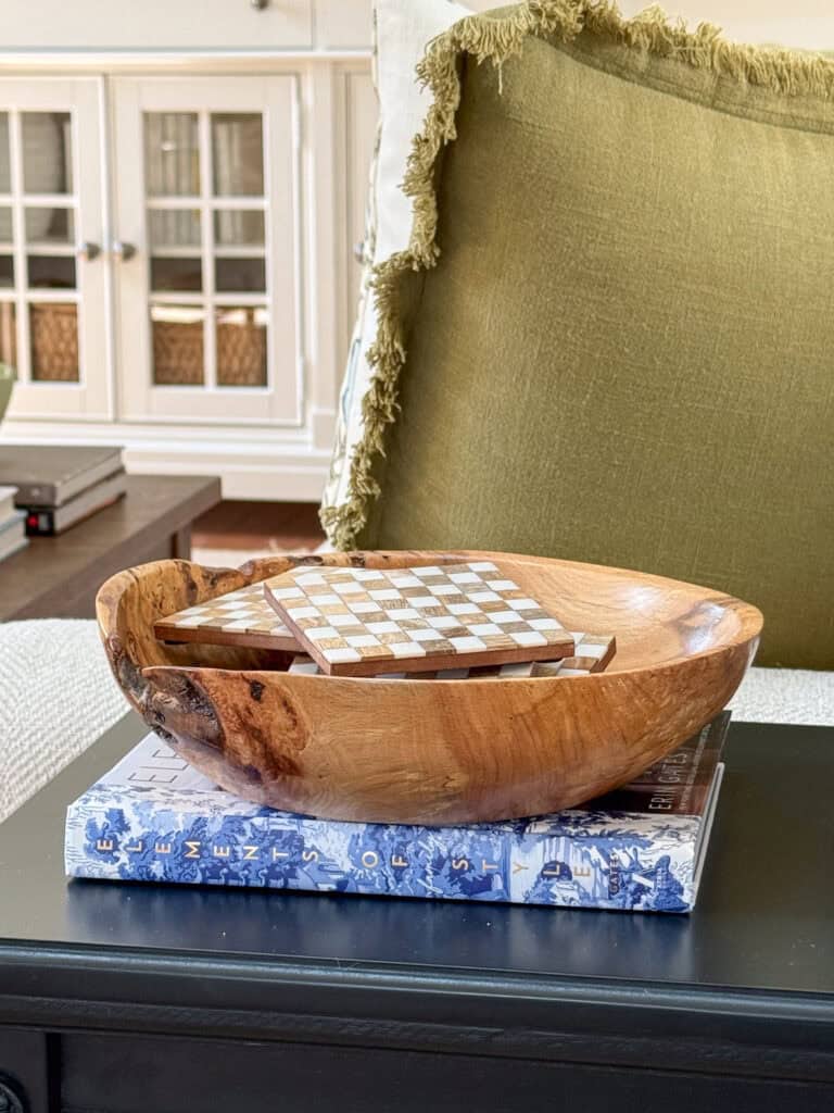 textral wooden bowl holding checkerboard coasters