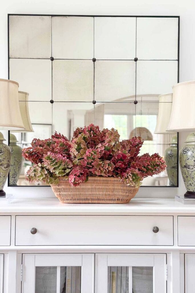 red hydrangeas on a white buffet